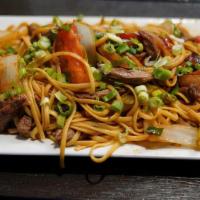 Tallarin Saltado De Carne · Homemade Peruvian stir-fried linguine sautéed with strips of beef, onions, and red bell pepp...