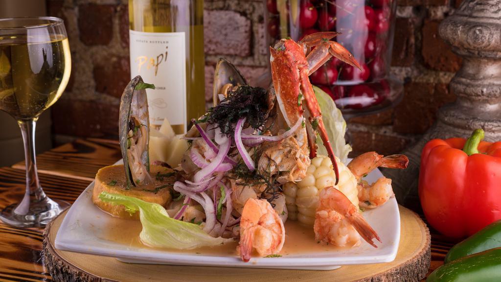 Ceviche Mixto · Freshly sliced fish fillet, shrimps, calamari, mussel, and crab marinated in lime juice and infused with red onions. Accompanied by Inca corn, potatoes, and sweet potatoes and topped with red onions and cilantro.