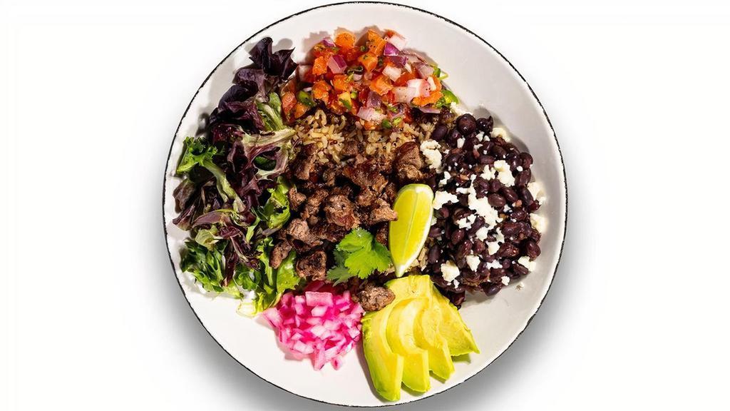 Carne Asada Bowl · Thinly sliced grilled sirloin, marinated black beans, queso fresco, pickled red onion, pico de gallo, mixed greens, salsa verde, blended grains