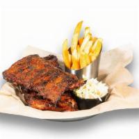 Old Bay Bbq Ribs · Slow-smoked & grilled St. Louis style. pork ribs basted with smoky BBQ sauce and dusted with...