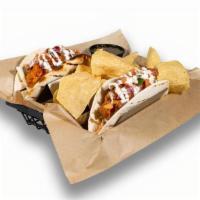 Buffalo Chicken Tacos · Hand breaded tenders, house slaw, kinda hot sauce, pico de gallo, ranch drizzle