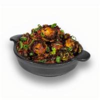 Flash-Fried Brussel Sprouts · Seasoned and smothered in honey, Golden BBQ, bacon, scallions