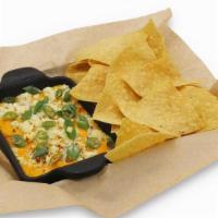 Buffalo Chicken Dip · Buffalo chicken dip, bleu cheese. crumbles, scallions, tortilla chips