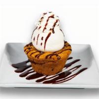 Cookie Lava Sundae · Chocolate chip cookie with a warm chocolate ganache center, then topped with a scoop of vani...
