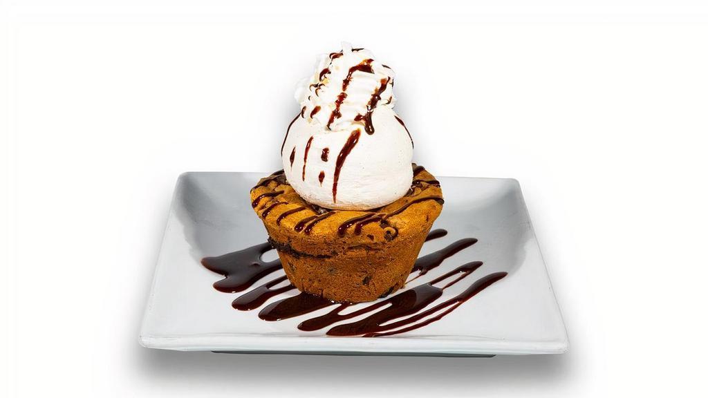 Cookie Lava Sundae · Chocolate chip cookie with a warm chocolate ganache center, then topped with a scoop of vanilla ice cream.