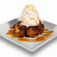Gooey Monkey Bread · Cinnamon sticky bun oozing with caramel sauce, then topped with Breyers® vanilla ice cream a...