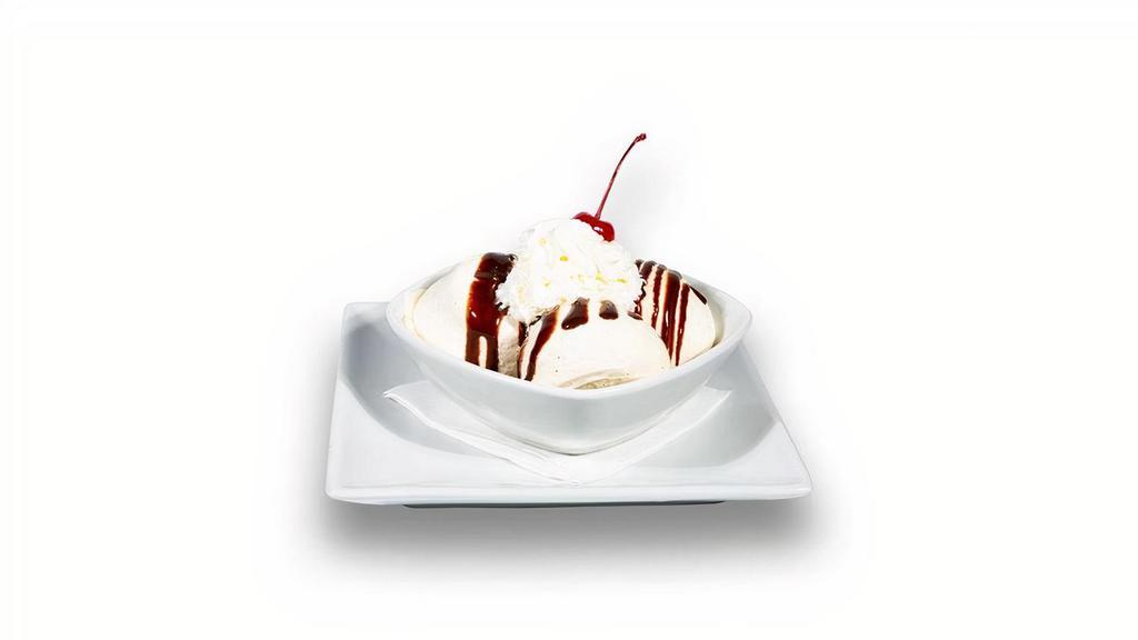 Ice Cream Sundae · Three scoops of vanilla ice cream, chocolate syrup, whipped cream and a cherry on top.