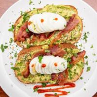 Sriracha Toast · Fresh avocado smash, bacon, sliced egg, bagel shop everything seeds mix and drizzled with Sr...