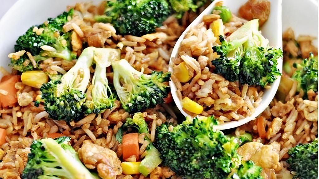 Vegetable Fried Rice · Vegetable fried rice with scallion, egg,  peas, broccoli
and carrots.