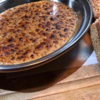Welsh Rarebit Fondue · Farmhouse Cheddar, Grain Mustard & Guinness. Sourdough Toast