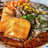 Veggie Ramen • · House Veggie Broth, Crispy Tofu, Shiitake Mushrooms, Roasted Corn, Pickled Cucumbers, Scalli...