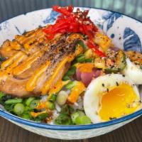 Chashu Pork Rice Bowl · soft egg, roasted corn, pickled daikon, pickled cucumbers, pickled red onions, pickled ginge...