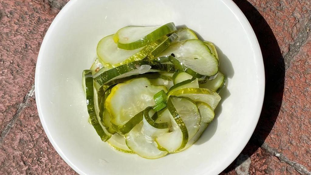 Side Of Pickled Cucumbers • · 4 ounce side cup of pickled cucumbers.
