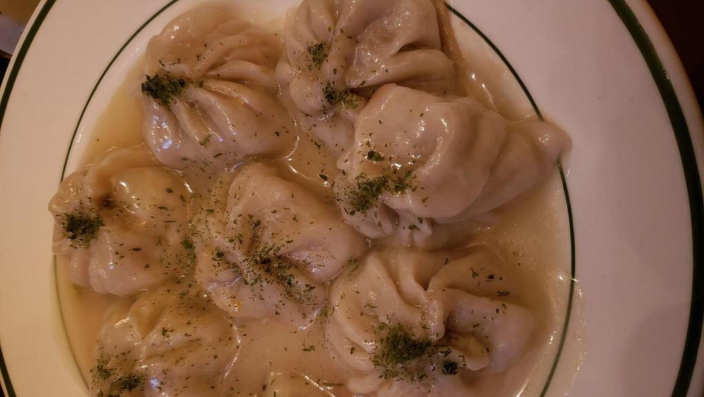 Kothe Momo (8 Pieces) · Lightly pan-fried juicy dumplings filled with mixed vegetables and your choice of meat then cooked over light vegetable broth.