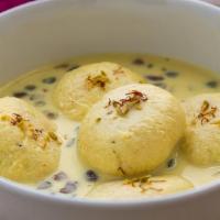 Ras Malai  · soft cheese patties soaked in sweet thickened milk.