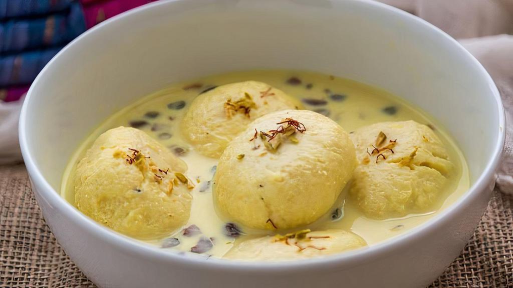 Ras Malai  · soft cheese patties soaked in sweet thickened milk.