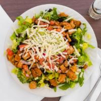 Grilled Chicken Salad · Marinated in chili sauce. Served with romaine lettuce, cheese, pinto or black beans, pico de...