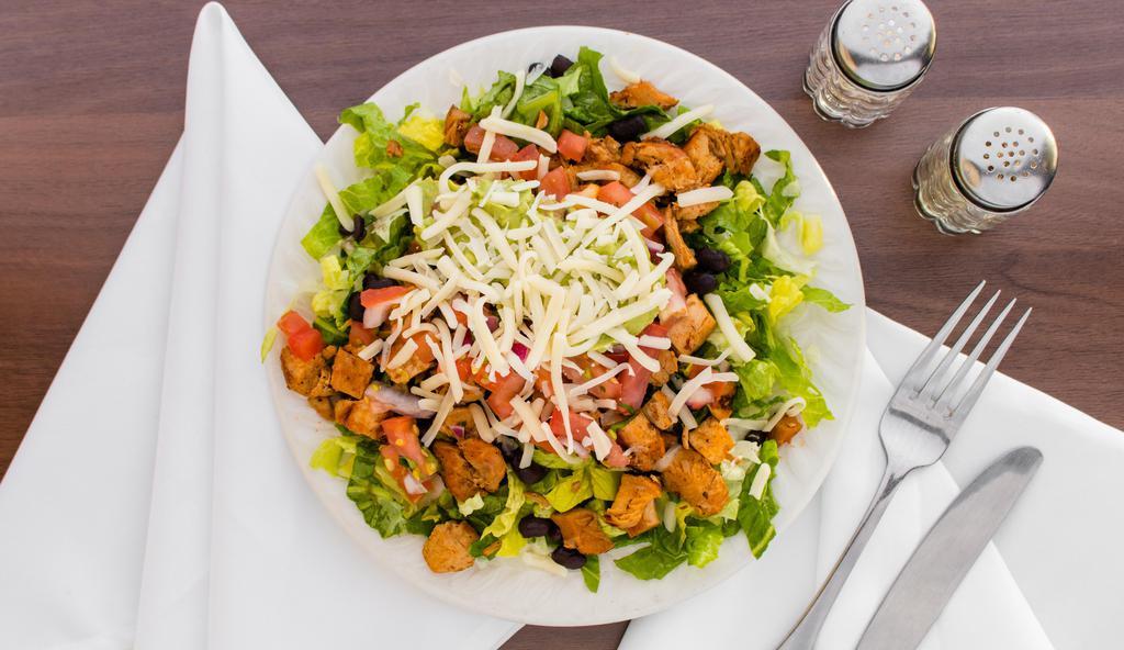 Grilled Chicken Salad · Marinated in chili sauce. Served with romaine lettuce, cheese, pinto or black beans, pico de gallo, guacamole and spicy lime cilantro dressing.