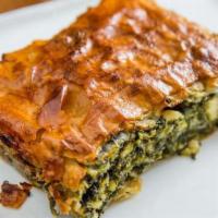 Spanikopita · Vegetarian. Spinach, leeks, dill, scallions, and feta cheese in phyllo dough.