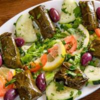 Grape Leaves · Vegan, gluten-free. Hand-rolled grape leaves, stuffed with rice, and herbs.