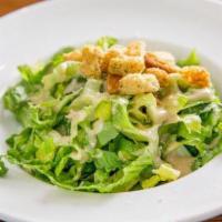 Caesar Salad · Romaine lettuce, croutons, Romano cheese, and creamy caesar dressing. Comes with pita bread.