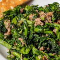 Broccoli Rabe & Sausage · Bitter Italian greens, sautéed in garlic and olive oil, served with our crumbled Italian sau...