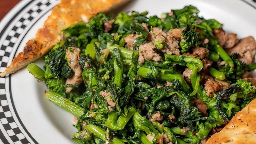 Broccoli Rabe & Sausage · Bitter Italian greens, sautéed in garlic and olive oil, served with our crumbled Italian sausage