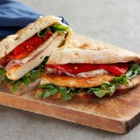Coal Oven Roasted Chicken Sandwich · Chicken breast topped with prosciutto, roasted red peppers, melted mozzarella, arugula and o...