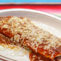 Enchiladas · A soft corn tortilla stuffed with ground beef, enchilada sauce, and cheese. Served with rice...