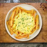 Cheese Fries · Idaho potato fries cooked until golden brown and garnished with salt and melted cheddar chee...