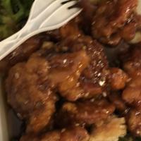 Sesame Chicken · Crispy chicken sautéed in sesame sauce. served w. steamed broccoli.