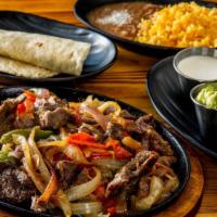 Fajitas · Choice of meat, onions, peppers, guacamole and cream. Served with rice and beans and tortill...