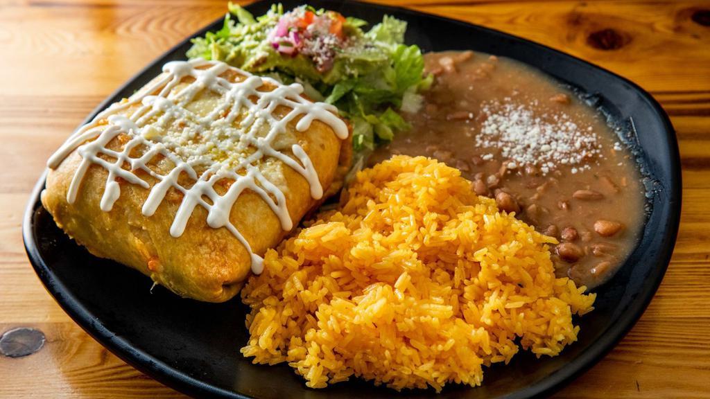 Chimichangas · Deep fried flour tortilla, beans, cheese and choice of meat. Served with rice and beans.