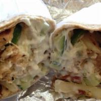 Athena Chicken Wrap · Fresh grilled chicken, roasted peppers, onions, diced tomatoes, cucumbers, feta cheese, tzat...