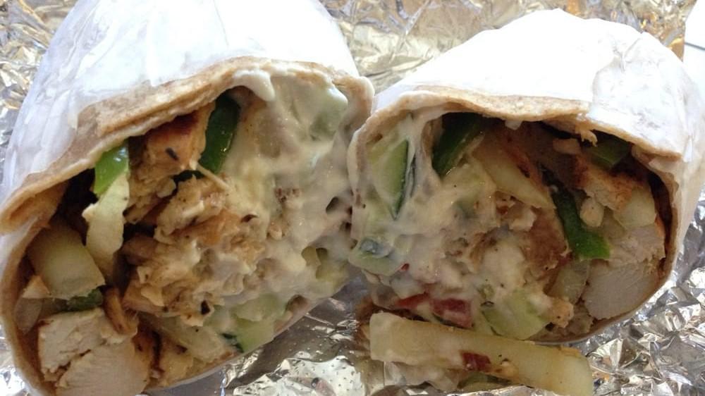 Athena Chicken Wrap · Fresh grilled chicken, roasted peppers, onions, diced tomatoes, cucumbers, feta cheese, tzatziki sauce.