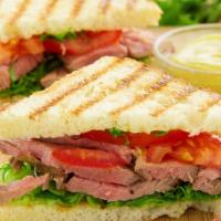 Southwestern Bbq Panini · Panini made with Roast beef, monterey jack cheese, sautéed onions, and barbeque sauce.