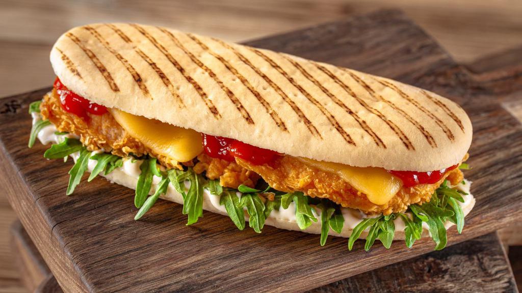 Ovengold Panini · Fresh Panini made with Turkey, provolone cheese, mix green tomatoes, balsamigrete. Served on pressed European flatbread and comes with chips and pickles on the side.