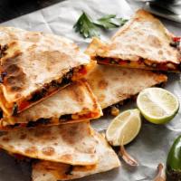 Veggie Quesadilla · Mouthwatering Quesadilla made with fresh Mozzarella cheese, and cheddar cheese. Topped with ...