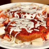 Chicken Parmesan Dinner · 2 Pieces of Char Broiled Chicken over a bed of Pasta covered in Homemade Sauce with melted M...