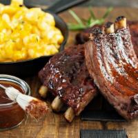 Full Rack · St. Louis style pork ribs are pit-smoked for 4 hours over a smoldering hickory fire. Then sl...