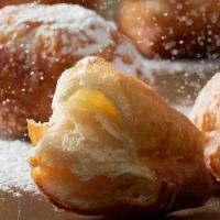 Croissant Beignet · Our Croissant Beignet is a flaky spin on the traditional beignet. As a feature in homestyle ...