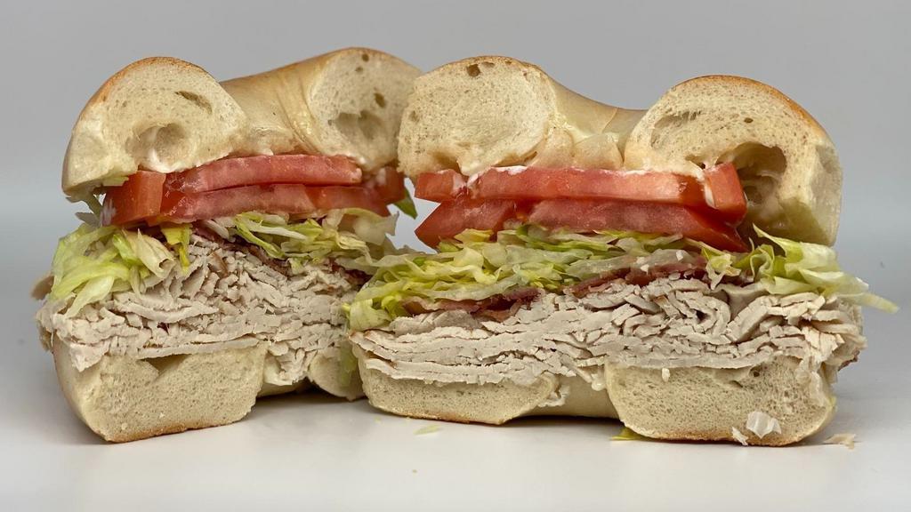 Turkey Blt · Thinly-sliced deli turkey, crispy bacon, lettuce, tomato & mayo. (PLEASE NOTE:  If we're sold out of your bread choice, we'll automatically substitute a plain bagel)