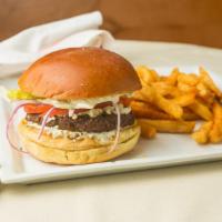 Greek Burger · Includes Feta, lettuce, tomato, and tzatziki sauce with French fries.