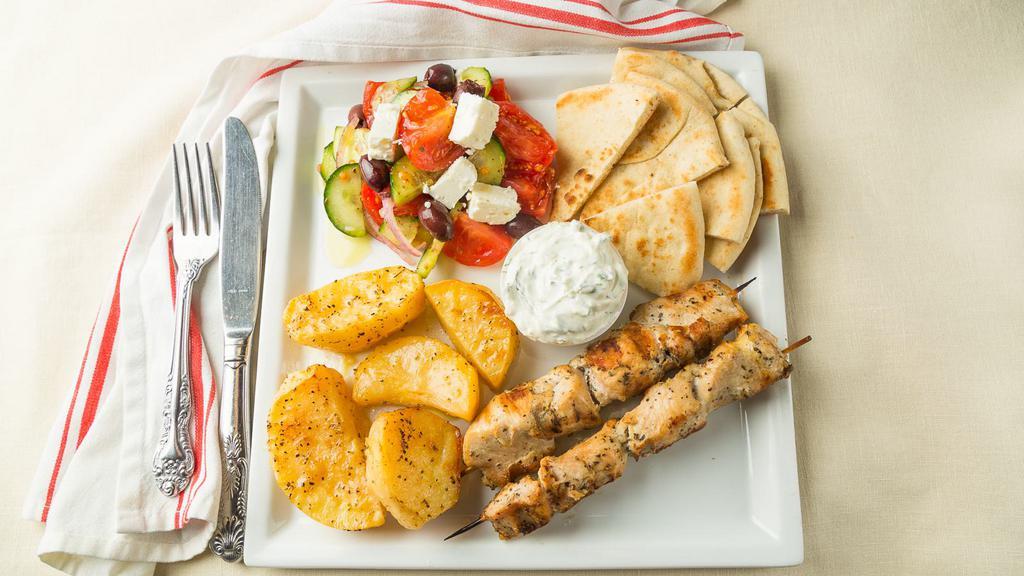 Chicken Souvlaki Platter · Served with any side salad, tzatziki or hummus, and pita.