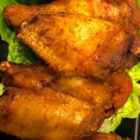 Tp Wings · Our famous deep fried chicken wings marinated with house recipe spices.
