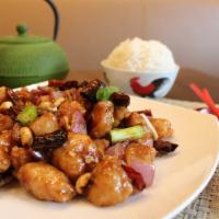 Kung Pao Chicken · Medium spicy. Can be extra spicy. Sautéed deep fried chicken with onion, dry chili, and pean...