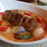 Grilled Duck Curry · Medium spicy. Can be extra spicy. Roasted duck curry with bell pepper, eggplant, pineapples,...