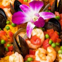 Paella Marinera · Shrimp, scallops, calamari, mussels and clams. Gluten free.