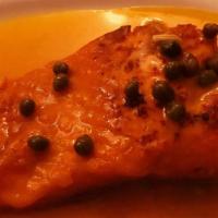 Salmon A La Sangria · Norweigan salmon with lemon and caper sauce.
