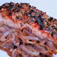 Grilled Salmon · Grilled salmon on a bed of sauteed onions with a red wine reduction. Gluten free.